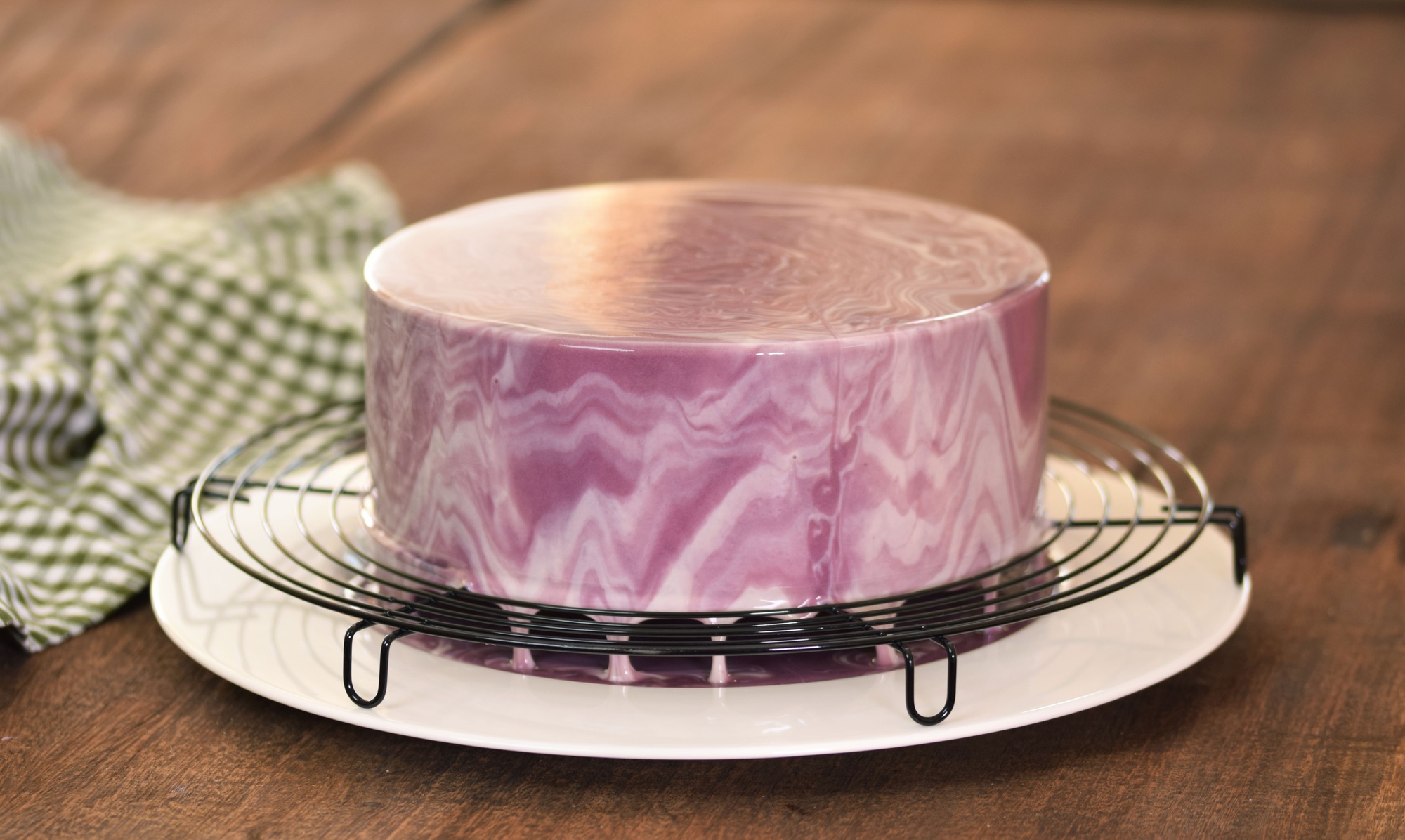 French Mousse Cake Covered With Purple Glaze.