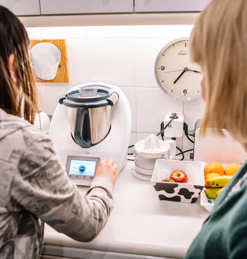 Barcelona, Spain, 15 January, 2021: Two women using thermomix at home