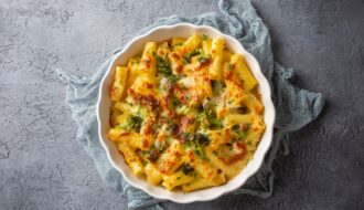 Pasta baked with broccoli and chicken. Broccoli, cheese and gratin sauce on baked penne pasta.