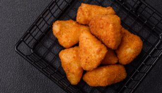 Breaded camembert or brie cheese baked in the form of nuggets with salt and spices