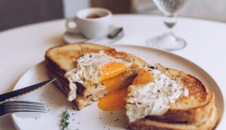Croque madame, french toast with poached egg, ham and cheese