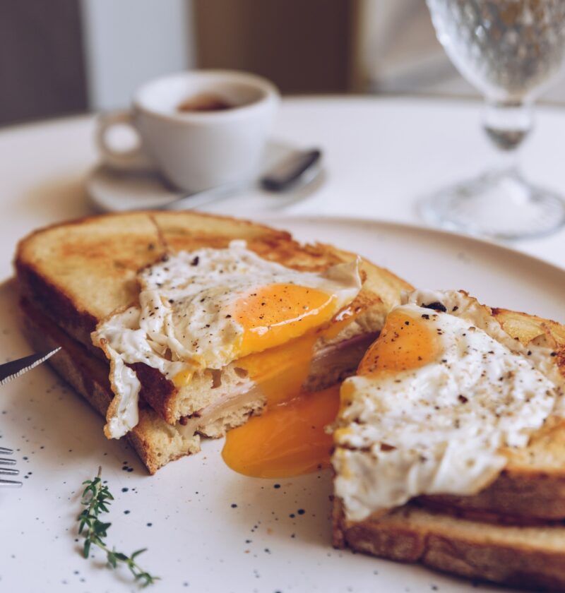 Croque madame, french toast with poached egg, ham and cheese