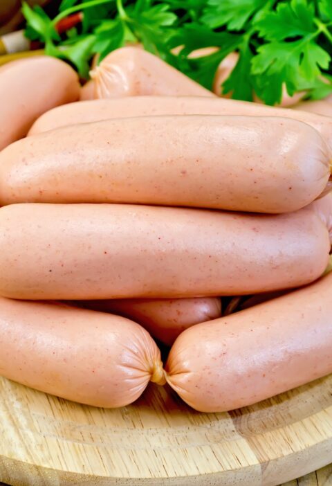 Sausages on a board with parsley