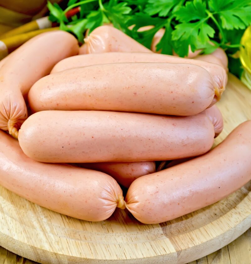 Sausages on a board with parsley