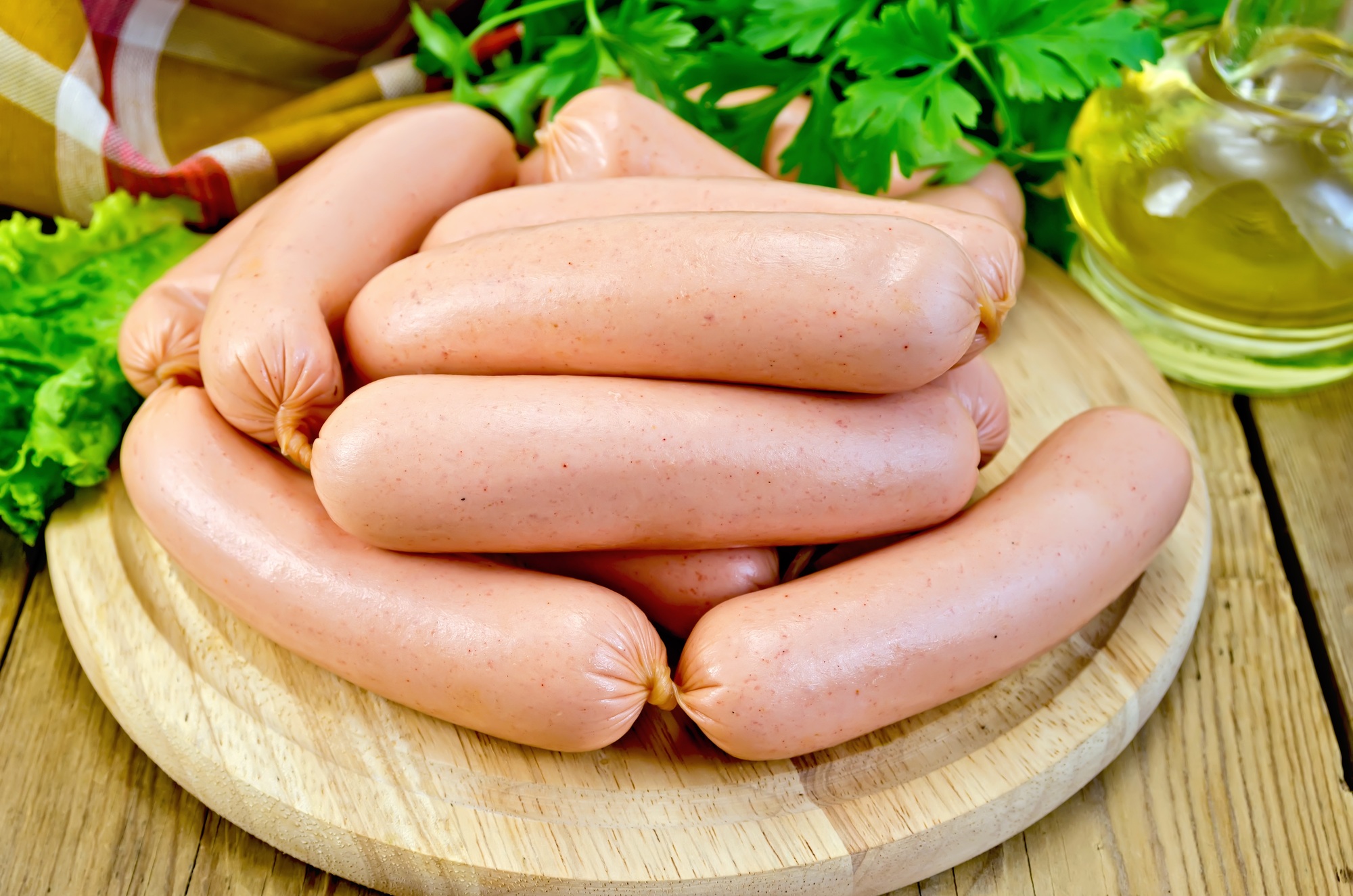 Sausages on a board with parsley