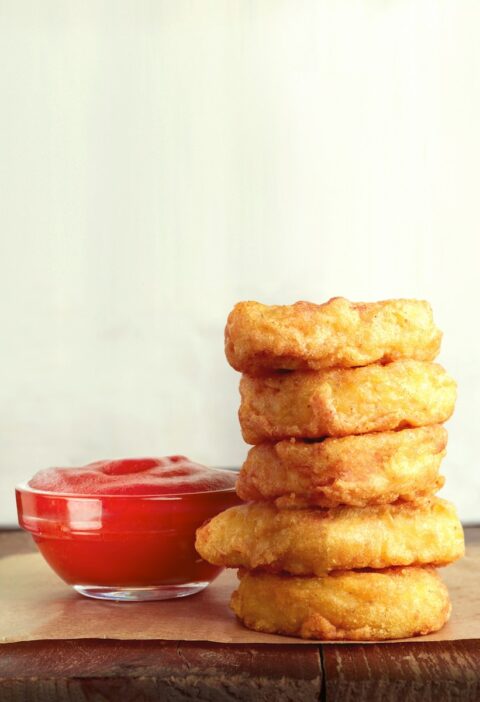 three cookies on brown wooden chopping board